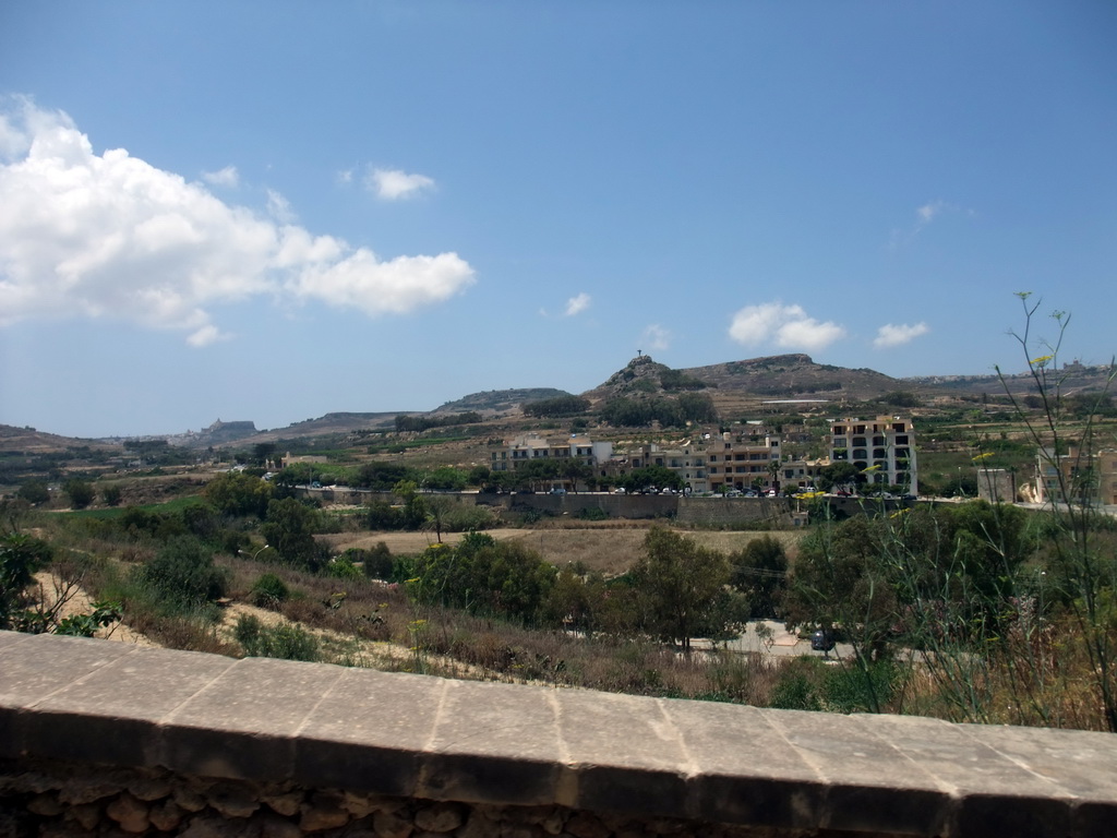 Statue of the Risen Christ on the Tal-Merzuq (Tas-Salvatur) Hill and surroundings, viewed from the Gozo tour jeep