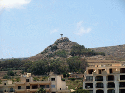 Statue of the Risen Christ on the Tal-Merzuq Hill, viewed from the Gozo tour jeep