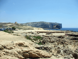 Fungus Rock (Il-Gebla tal-General, the General`s Rock) and a watch tower at Dwejra Bay, viewed from the Gozo tour jeep