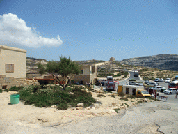 Watch tower and houses at Dwejra Bay, viewed from the Gozo tour jeep