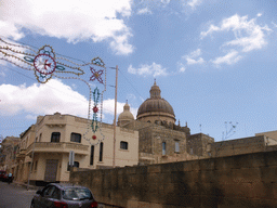 Decorated streets of Xewkija with the Church of St. John the Baptist, viewed from the Gozo tour jeep