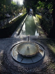 Pond, fountain and trees at the Jardines Nuevos gardens at the Palacio de Generalife