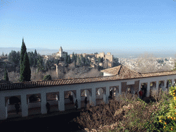 The Alhambra palace, the city of Granada and the Patio de la Acquia courtyard, viewed from the Jardines Altos gardens at the Palacio de Generalife