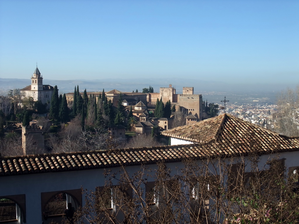 The Alhambra palace, the city of Granada and the Patio de la Acquia courtyard, viewed from the Jardines Altos gardens at the Palacio de Generalife