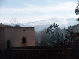 The Torre de Baltasar de la Cruz at the Alhambra palace, and the Sierra Nevada mountains