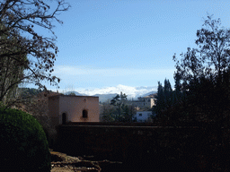 The Torre de Baltasar de la Cruz at the Alhambra palace, and the Sierra Nevada mountains