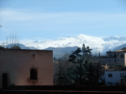 The Torre de Baltasar de la Cruz at the Alhambra palace, and the Sierra Nevada mountains