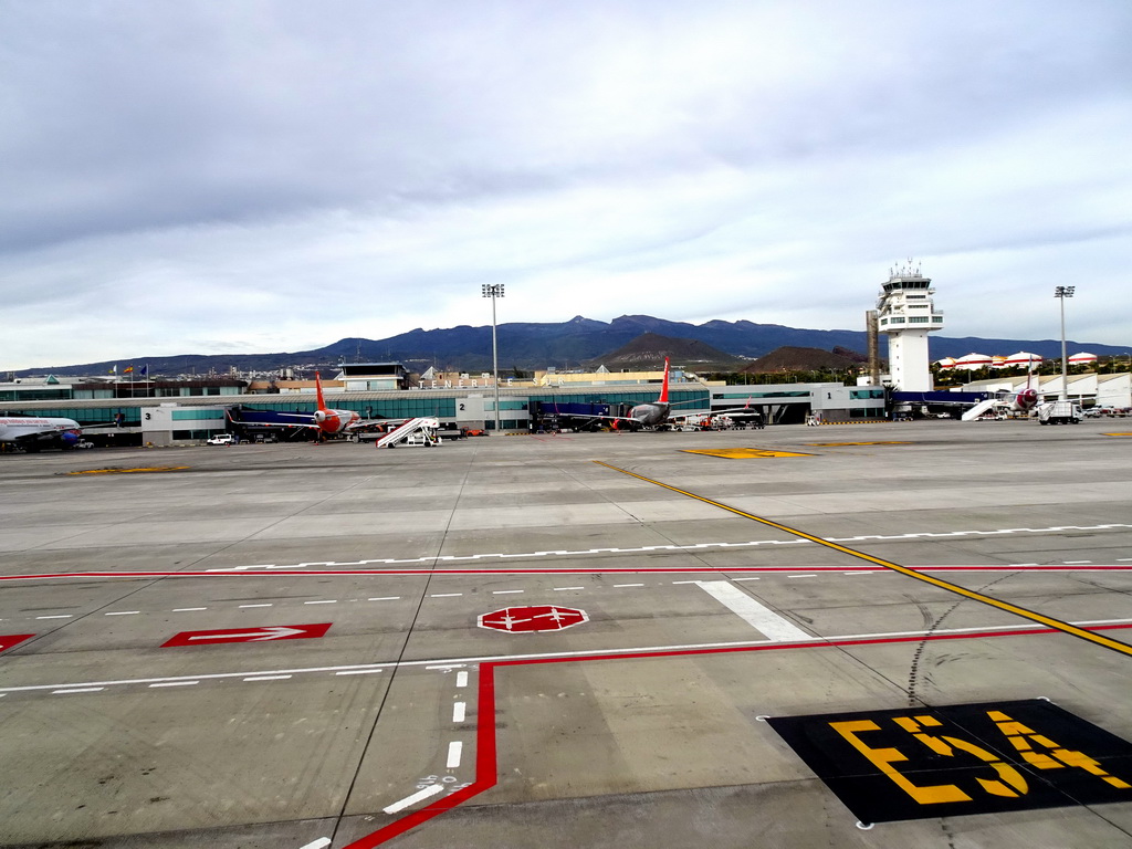 Airplanes and control tower at Tenerife South Airport and Mount Teide, viewed from the airplane to Amsterdam