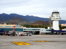 Airplane and control tower at Tenerife South Airport and Mount Teide, viewed from the airplane to Amsterdam