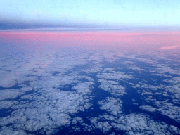 Cloudy sky above the Atlantic Ocean, viewed from the airplane to Amsterdam, at sunset