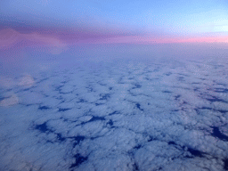 Cloudy sky above the Atlantic Ocean, viewed from the airplane to Amsterdam, at sunset