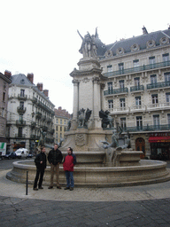 Rick, David and Paul at a fountain at the Place Notre-Dame square