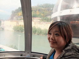 Miaomiao in the cable lift to the Bastille