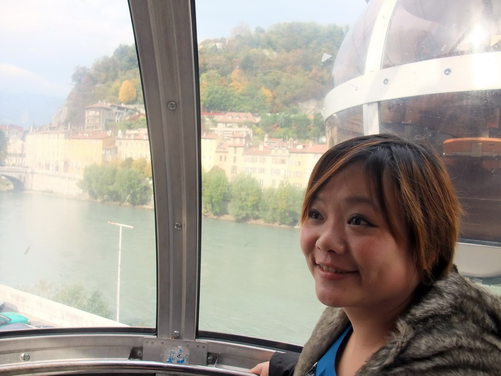 Miaomiao in the cable lift to the Bastille