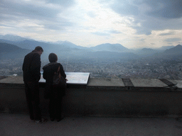 Miaomiao and David at the top of the Bastille, with a view on the city center