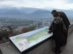 Miaomiao and David with an explanation at the top of the Bastille, with a view on the southeast side of the city