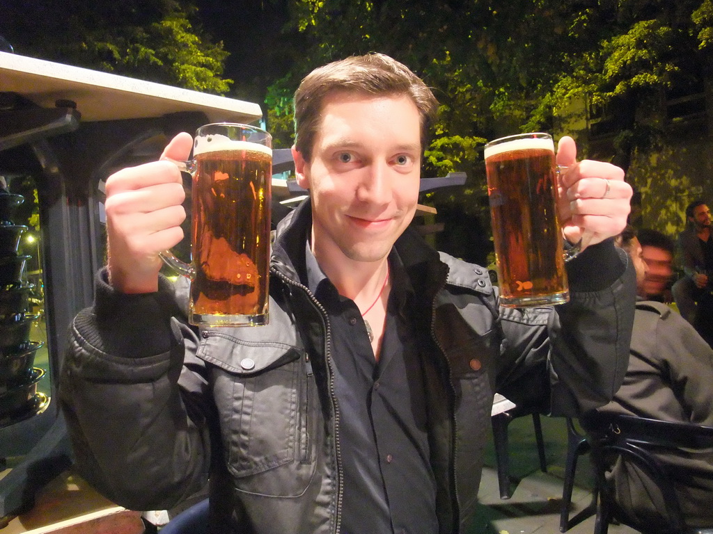 Tim with beers at a pub in the city center