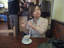 Miaomiao with coffee and David in the restaurant `Relais du Château`
