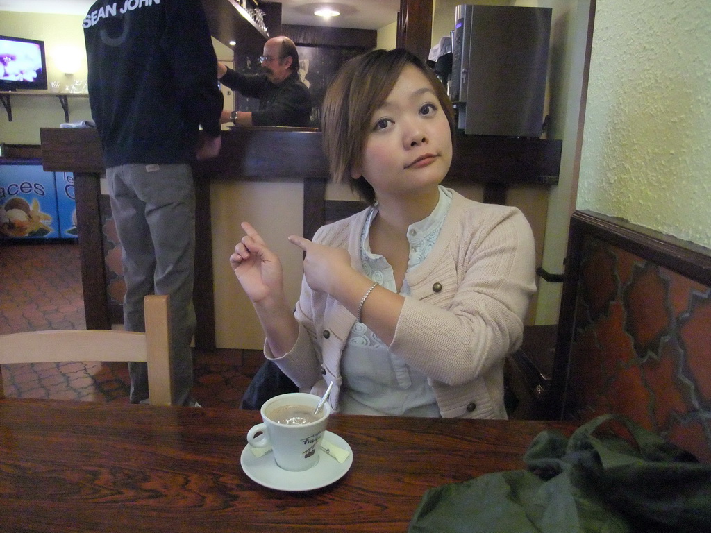 Miaomiao with coffee and David in the restaurant `Relais du Château`