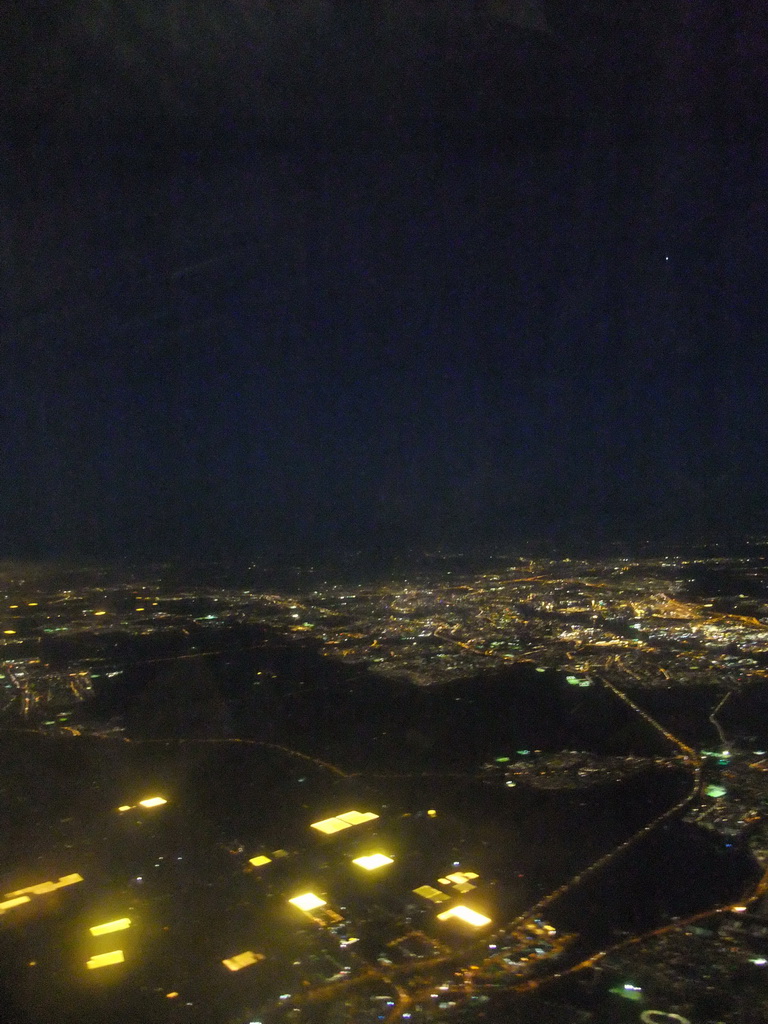 View on Amsterdam and surroundings from our airplane from Strasbourg to Amsterdam, by night