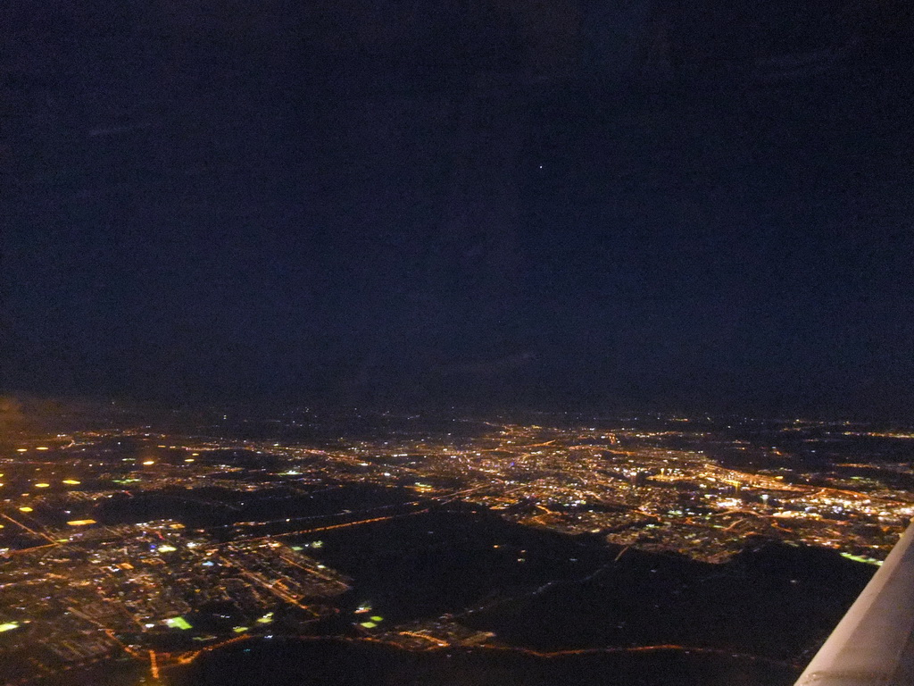 View on Amsterdam and surroundings from our airplane from Strasbourg to Amsterdam, by night