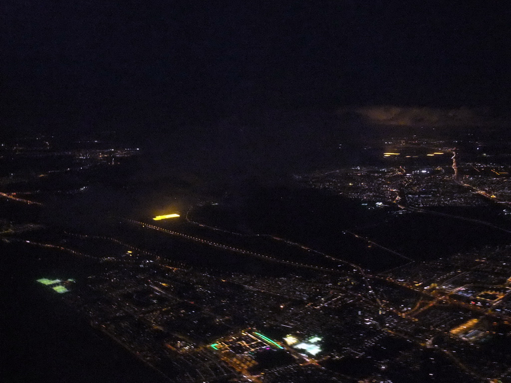 View on Amsterdam and surroundings from our airplane from Strasbourg to Amsterdam, by night