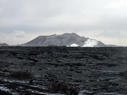 Rocks and mountains, and smoke coming from the Blue Lagoon geothermal spa