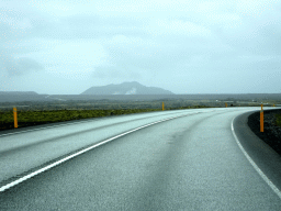 The Grindavíkurvegur road and smoke from the Svartsengi Power Station and the Blue Lagoon geothermal spa, viewed from the rental car