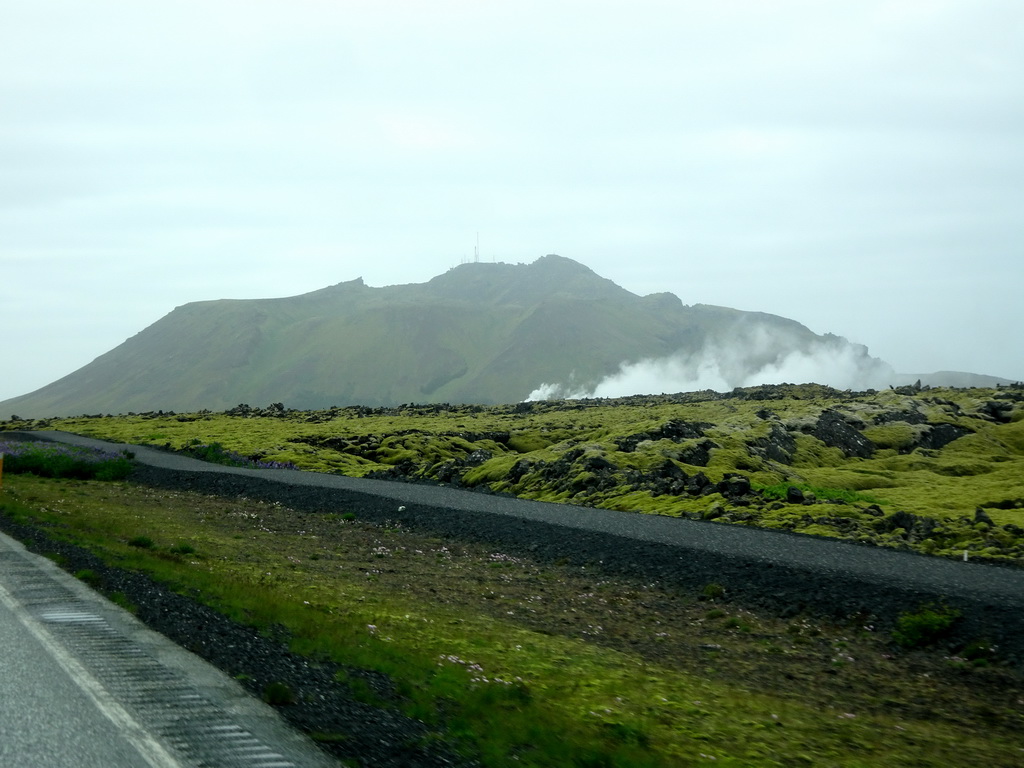 Smoke from the Svartsengi Power Station and the Blue Lagoon geothermal spa, viewed from the rental car on the Grindavíkurvegur road