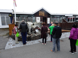 Miaomiao and her parents in front of the Fish House restaurant at the Hafnargata street