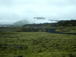 Smoke from the Svartsengi Power Station and the Blue Lagoon geothermal spa, viewed from the rental car on the Nordurljosavegur road