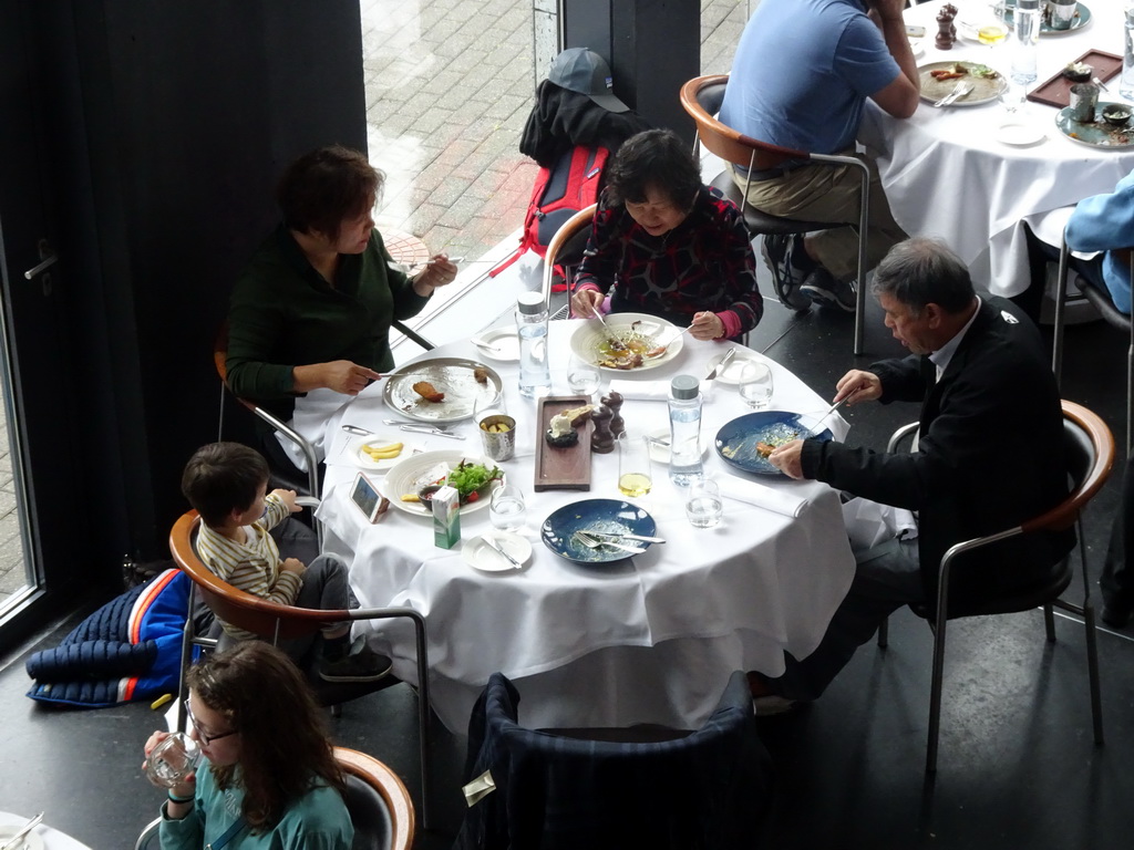 Miaomiao, Max and Miaomiao`s parents having dinner at the LAVA Restaurant at the Blue Lagoon geothermal spa, viewed from the upper floor