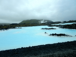 Water and rocks near the Svartsengi Power Station and the Blue Lagoon geothermal spa, viewed from the rental car on the Grindavíkurvegur road