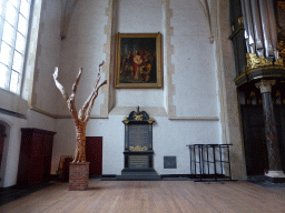 Southwest corner of the Martinikerk church, with a sculpture, a tomb and a painting