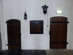 Doors, window and bell at the northeast side of the ambulatory of the Martinikerk church