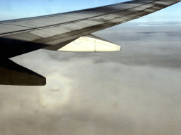 Clouds with a glory around the shadow of the airplane, viewed from the airplane from Amsterdam to London