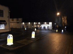 Front of the March Hare restaurant and the Guildford Castle at the crossing of Castle Street and South Hill, by night