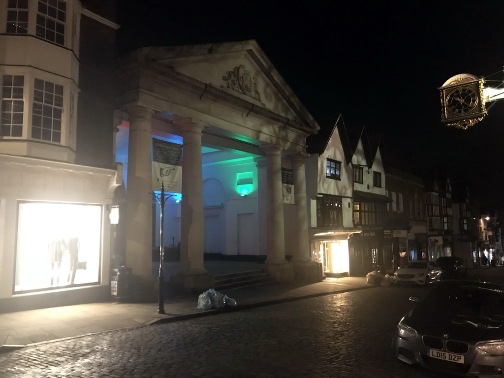 Front of the Tunsgate Arch and the clock of te Guildhall at High Street, by night