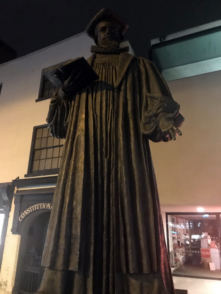 Statue of George Abbot, at the crossing of North Street and High Street, by night