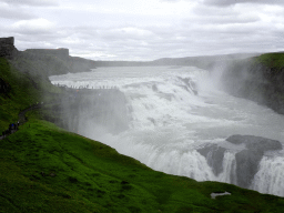 The Gullfoss waterfall, viewed from the path from the lower viewpoint to the closeby viewpoint