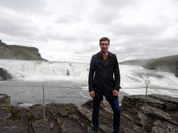 Tim at the closeby viewpoint of the Gullfoss waterfall, with a view on the upper part