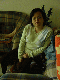 Miaomiao`s sister in the living room of her parents` place