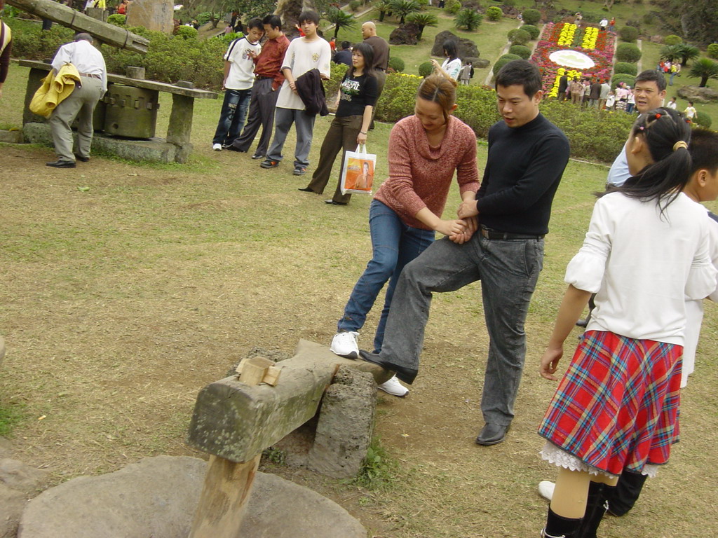 Miaomiao`s family members at the old village at the Hainan Volcano Park