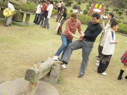 Miaomiao`s family members at the old village at the Hainan Volcano Park