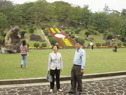 Miaomiao`s parents in front of Mt. Fengluling volcano crater at the Hainan Volcano Park