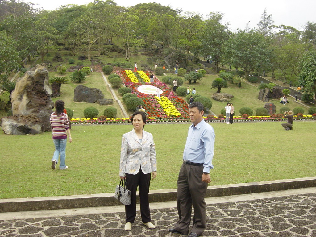 Miaomiao`s parents in front of Mt. Fengluling volcano crater at the Hainan Volcano Park