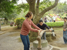 Miaomiao`s family members at the old village at the Hainan Volcano Park, with a view on the front of Mt. Fengluling volcano crater