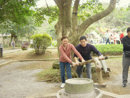 Miaomiao`s family members at the old village at the Hainan Volcano Park, with a view on the front of Mt. Fengluling volcano crater