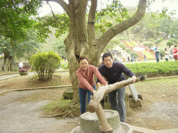 Miaomiao`s family members at the old village at the Hainan Volcano Park, with a view on the front of Mt. Fengluling volcano crater