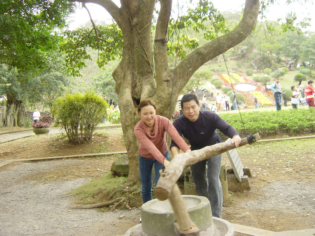 Miaomiao`s family members at the old village at the Hainan Volcano Park, with a view on the front of Mt. Fengluling volcano crater